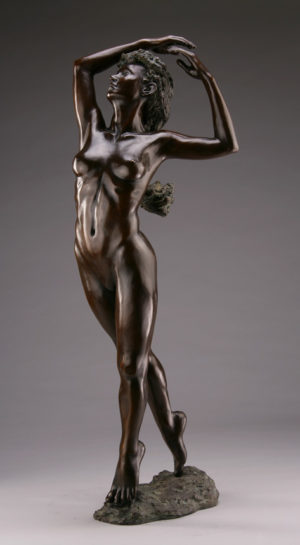 Entitled Flamenco, this is a photograph depicting a one-quarter life-size bronze sculpture of a standing female figure, created by sculptor Blake Ward