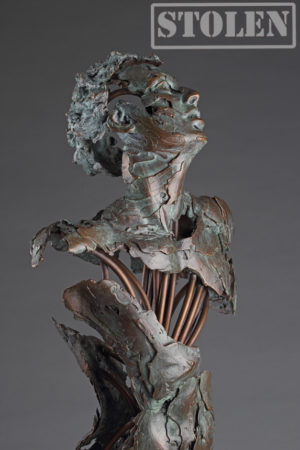 Entitled Angel de la Mer , this is a bronze sculpture of a partial male figure with an exposed interior structure created by sculptor Blake Ward.