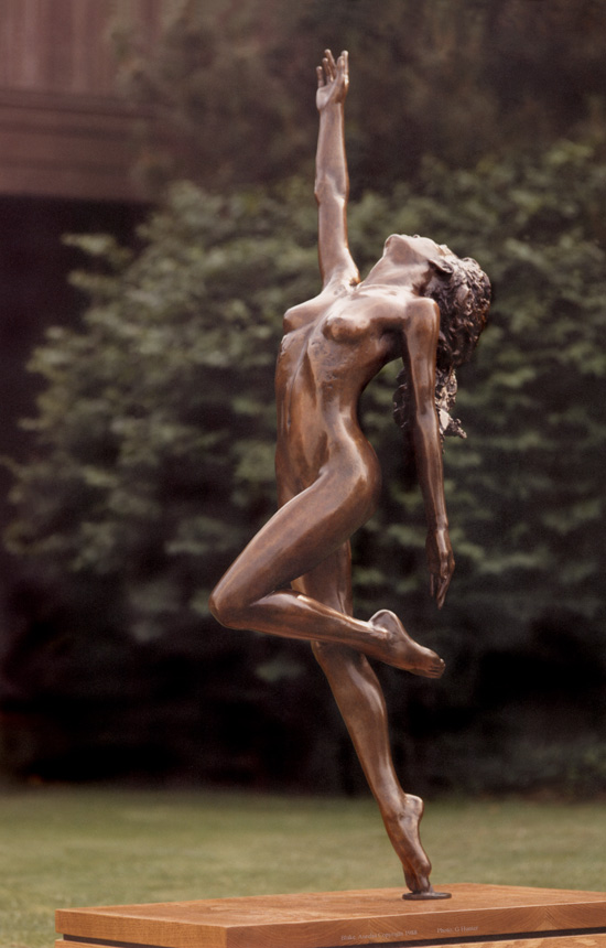 Entitled The Bather, this is a photograph depicting a one-quarter life-size bronze sculpture of a sitting female figure, created by sculptor Blake Ward