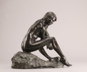 Entitled The Bather, this is a photograph depicting a one-quarter life-size bronze sculpture of a sitting female figure, created by sculptor Blake Ward