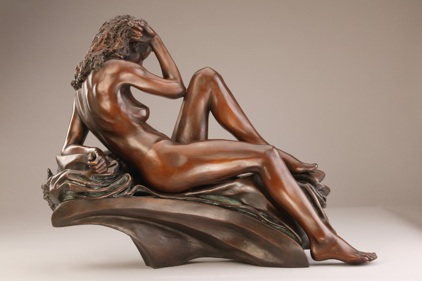 Entitled La Notte, this is a photograph depicting a one-quarter life-size bronze sculpture of a sitting female figure, created by sculptor Blake Ward