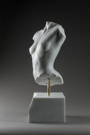 Entitled Miniel, this is a photograph depicting a one-quarter life-size marble sculpture of a partial female torso, created by sculptor Blake Ward