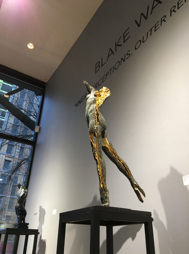 Photo of a one-quarter life-size partial female figure in bronze with an exposed interior structure by Blake Ward Blake Sculpture